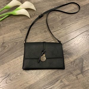 SOLD on Mercari <<—-Black w/gold crossbody purse
